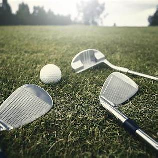 golf iron, putter, and ball